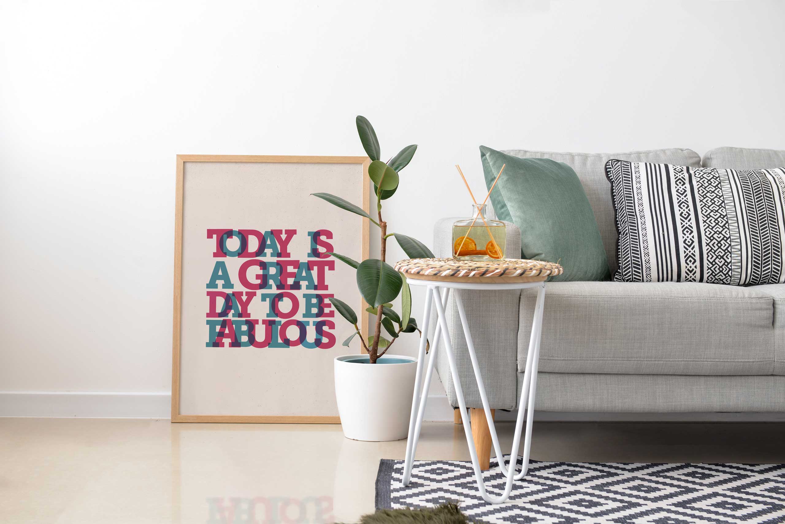 A typographic wall art print example next to a sofa from Baldy and The Fidget