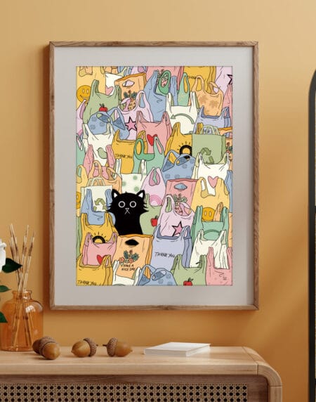Celebration cat art print featuring a playful black cat among pastel shopping bags
