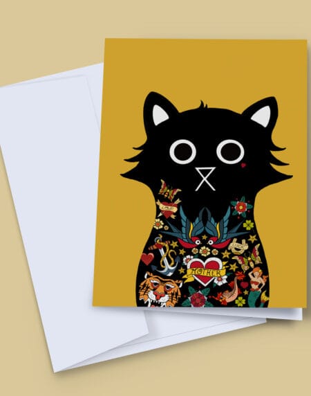 A hand-illustrated greeting card of a black cat covered in Sailor Jerry tattoos