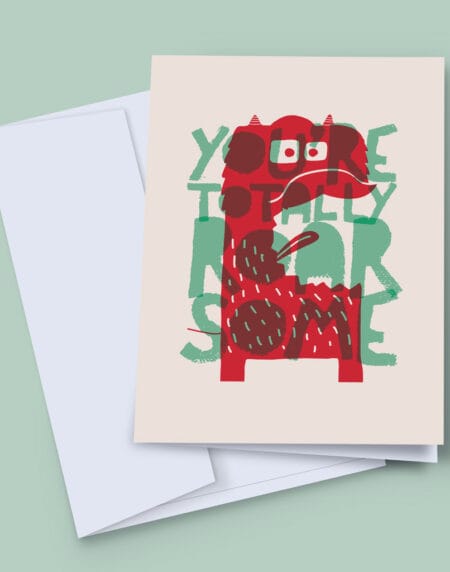 A 7x5 inch greeting card, featuring a cute monster, saying you're totally roar some, in red and turquoise