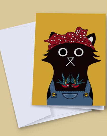A hand illustrated cat greeting card, featuring a black cat with blue dungarees and a chest tattoo