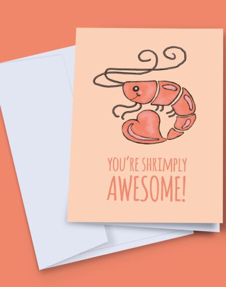 a greeting card titled Shrimply Awesome, with a hand-illustrated shrimp above the wording, done in shades of pink