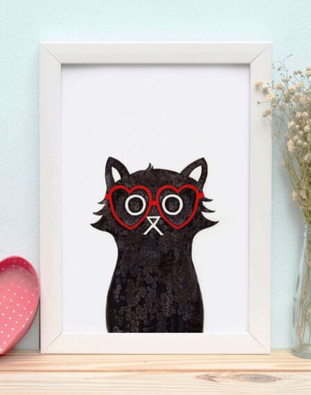 a salt and ink illustrated cat that's wearing red glasses in the shape of a heart