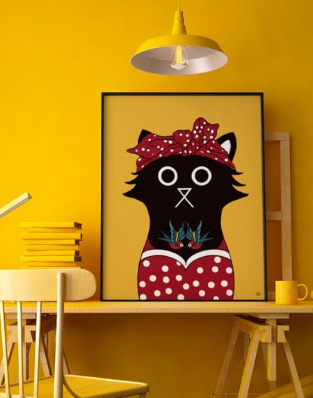 digitally drawn black cat on a yellow background, dressed as a rockabilly cat, with red & white polka dot dress & head scarf