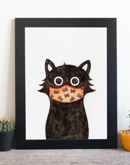 ink and salt illustration print of a black cat, wearing an orange mask covered in tiger heads