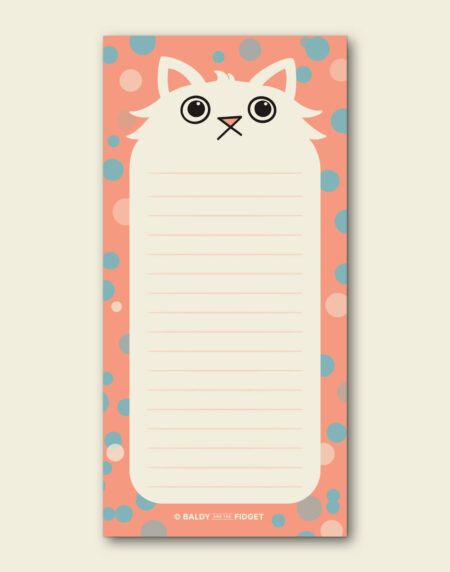 A DL notepad featuring a fluffy white cartoon cat with wide eyes on a coral background scattered with teal and pink spots. The Paws for Thought cute cat notepad measures 99mm x 210mm, contains 50 pages of 100gsm lined paper and comes wrapped in a Baldy and the Fidget branded belly band and protective clear sleeve.